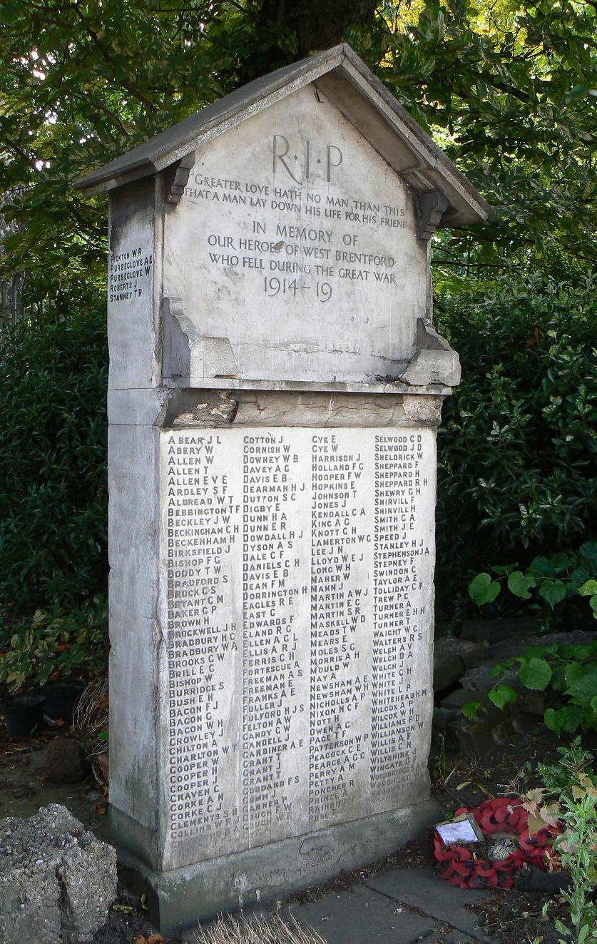 Stone war memorial with four columns of names; a further five names are inscribed on the side of the memorial