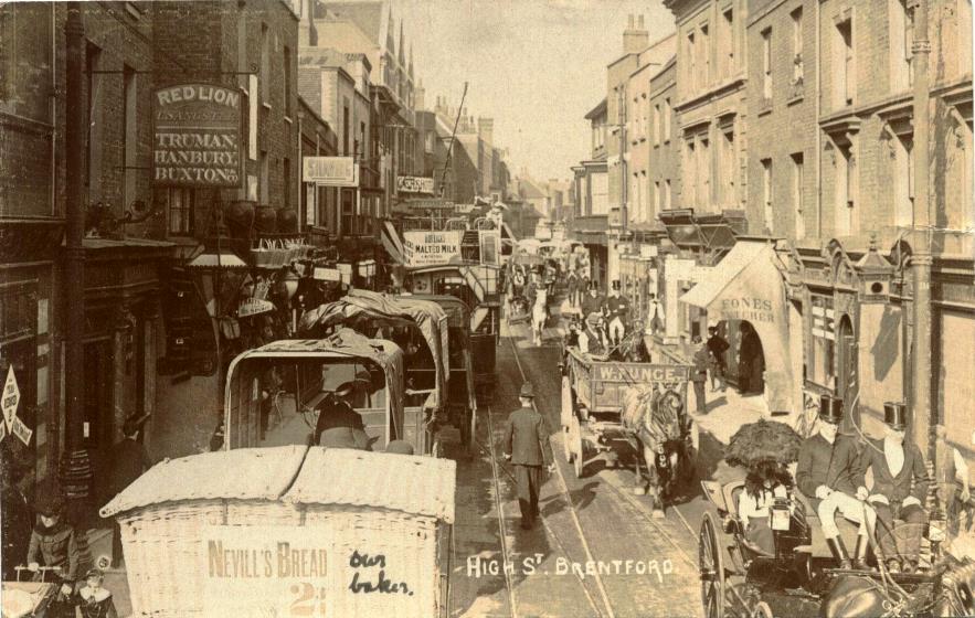 A view of the congested roadway with a tram, tradesmen's carts and some carriages. In the foreground a note 'our baker' has been added to a 'Nevill's Bread' cart