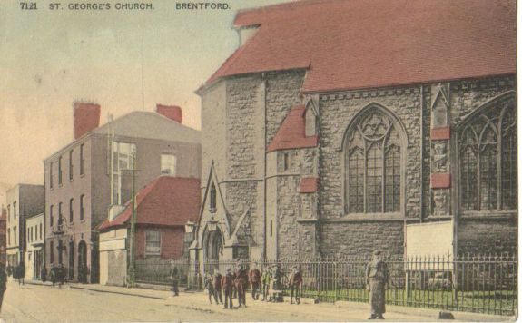 Tinted postcard of church and surrounding buildings