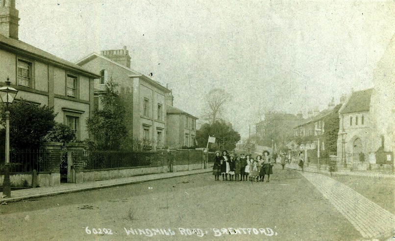View along Windmill Road with a group of children centre