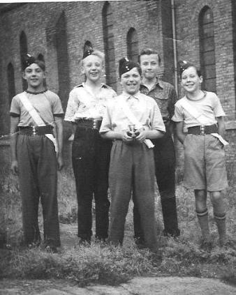 Group of 5 boys, one holding a silver cup