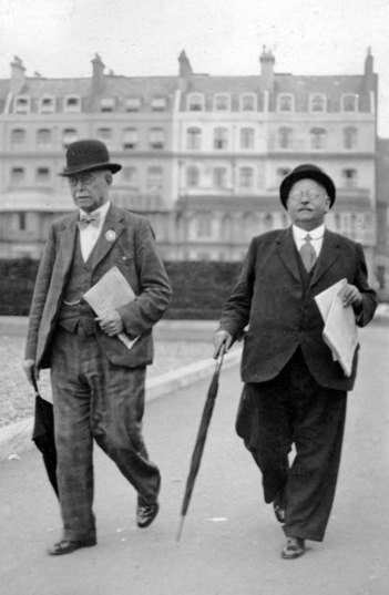 Two smartly dressed city gents, London?
