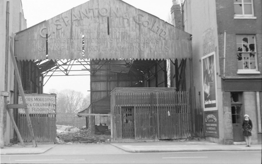 B/w photo of entrance to a timberyard