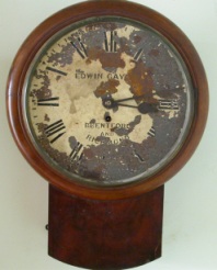 Wood surround clock, face includes Edwin Gaydon Brentford and Richmond
