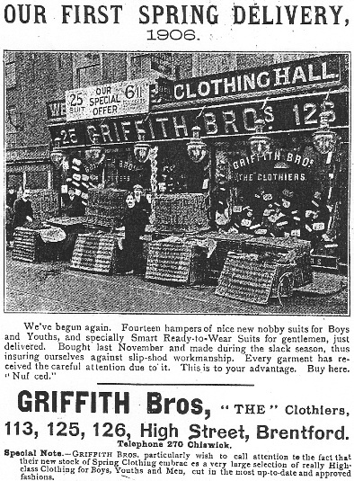 Photo taken outside the shop in 1906 showing 'fourteen hampers of nice new nobby suits for Boys and Youths'