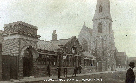 Post Office: brick building with 6 young male postal workers outside, also St Paul's church
