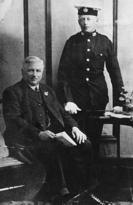 Thomas Knight seated, his son Tom in uniform, standing