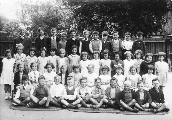 Schoolmaster with 45 children