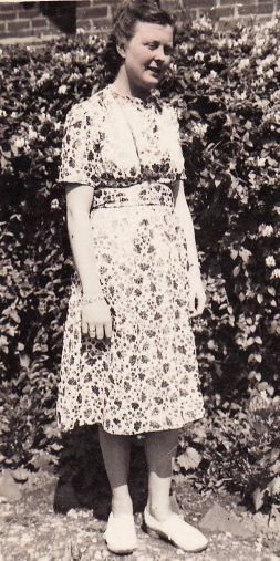 Girl in her late teens or early twenties in garden